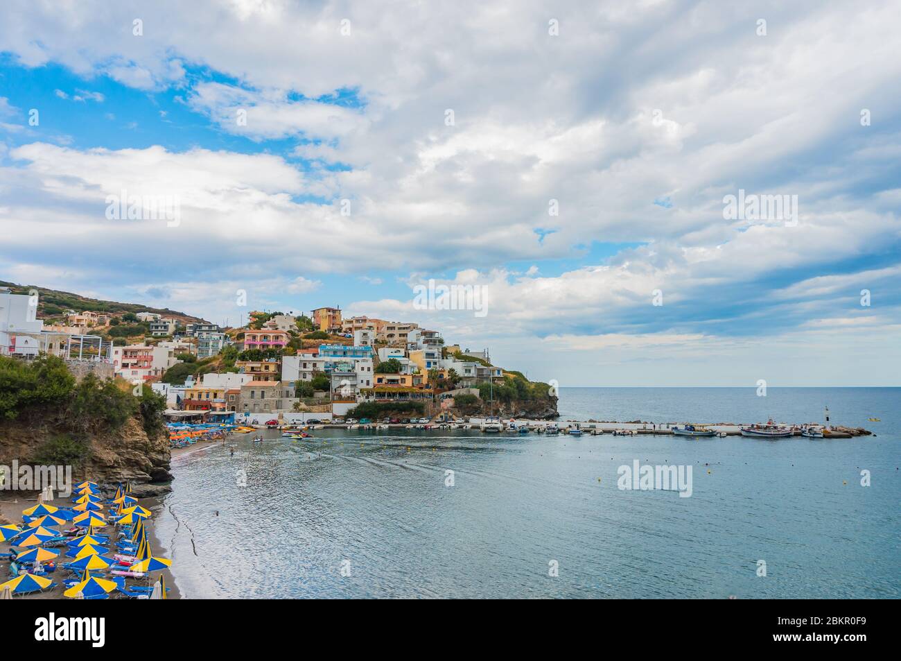 Bali, Crete, Greece - October 7, 2019: The colorful bay of the popular resort of Crete with an amazing sea, beach, elegant mountainside houses, a pier Stock Photo