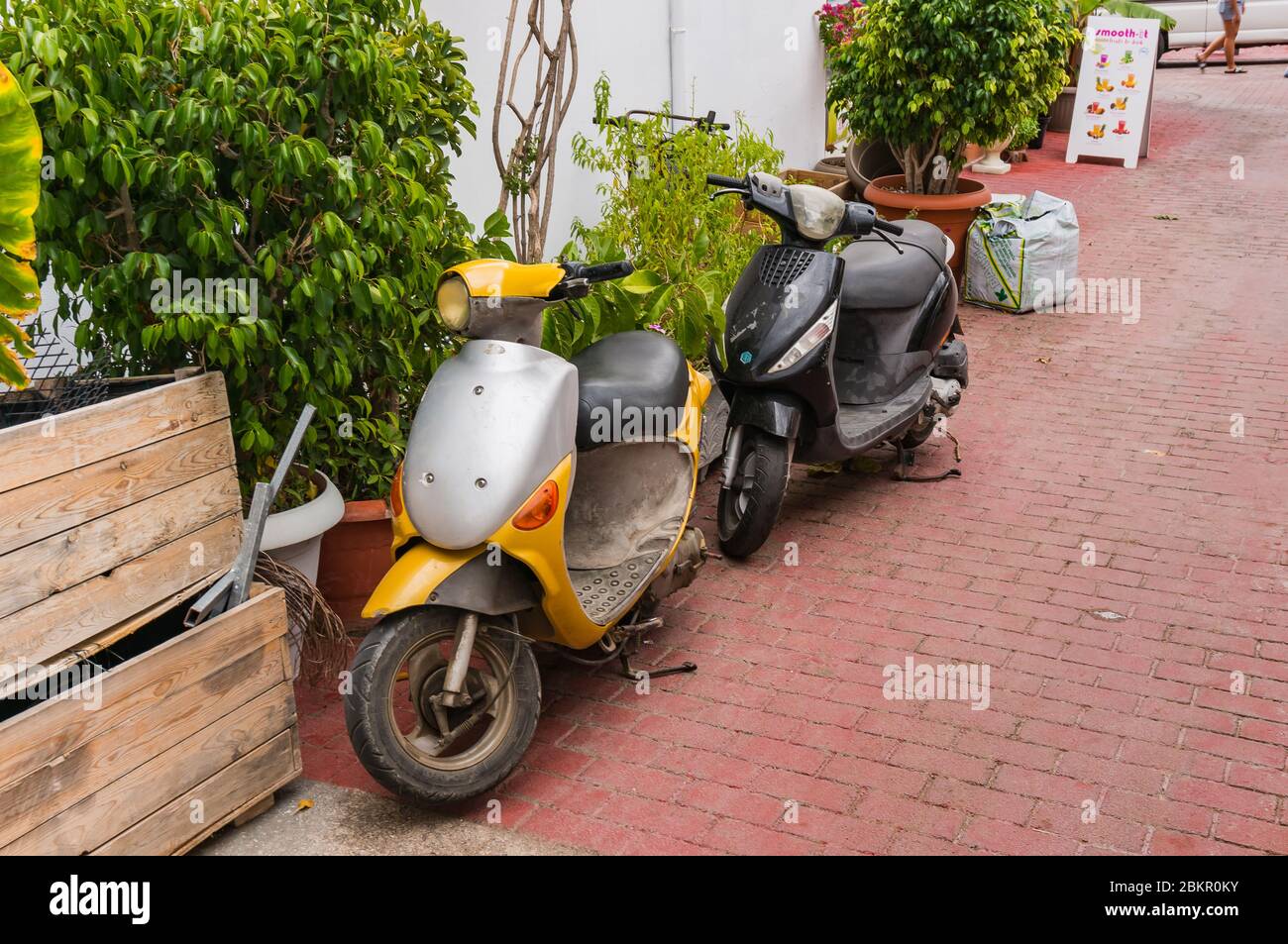Bali, Crete, Greece - October 7, 2019: Old vintage scooters on a cozy street of the popular resort of Crete Stock Photo