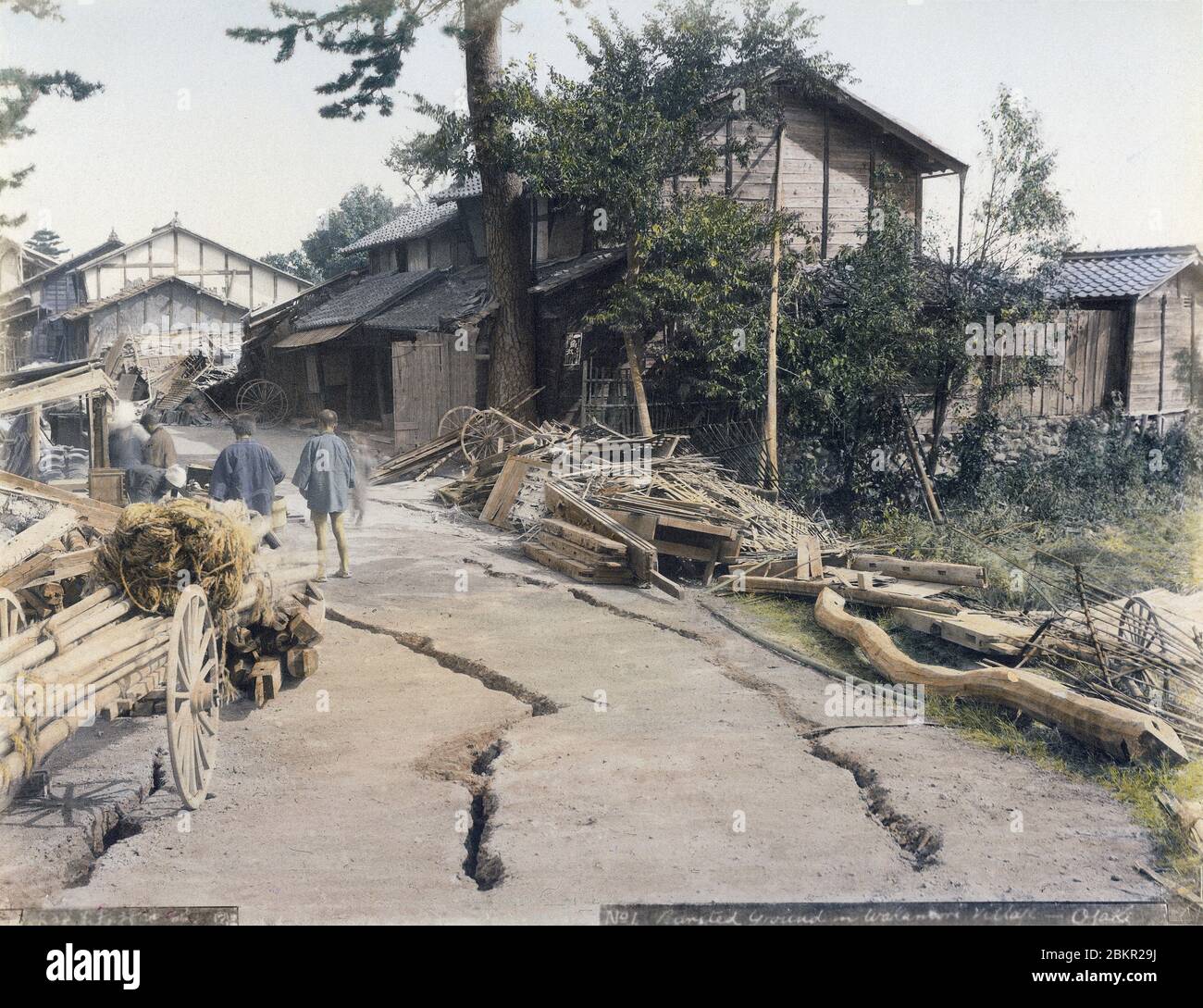 [ 1890s Japan - Nobi Earthquake ] —   Devastation in Ogaki Wakamori Village (大垣若森村) in Gifu Prefecture caused by the Nobi Earthquake (濃尾地震, Nobi Jishin) of October 28, 1891 (Meiji 24). Debris is piled up along a cracked road.  The Nobi Earthquake measured between 8.0 and 8.4 on the scale of Richter and caused 7,273 deaths, 17,175 casualties and the destruction of 142,177 homes.  The quake is also referred to as the Mino-Owari Earthquake (美濃尾張地震, Mino-Owari Jishin).  19th century vintage albumen photograph. Stock Photo