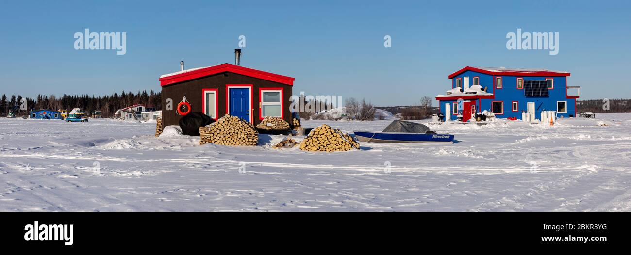 Canada, Northwest Territories, Yellowknife, houseboats resting on the frozen waters of Great Slave Lake Stock Photo