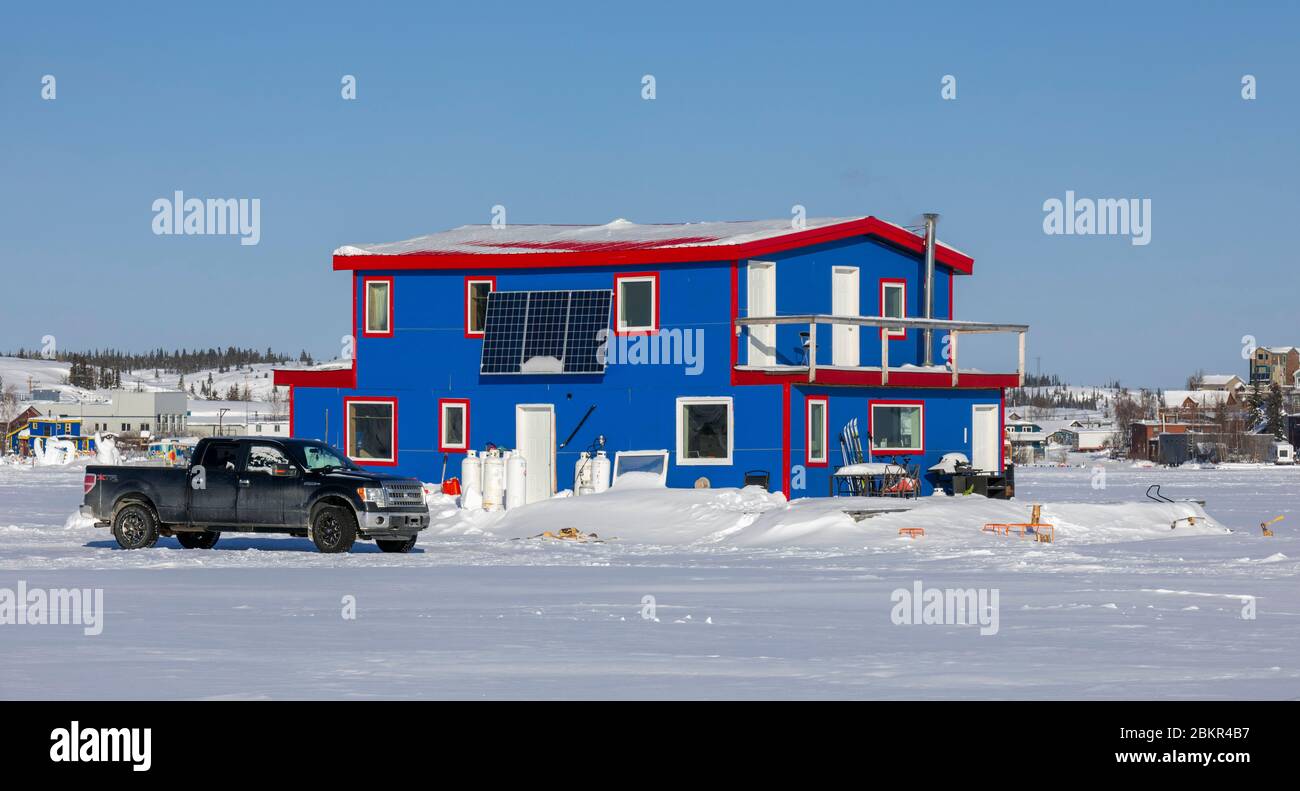 Canada, Northwest Territories, Yellowknife, houseboats resting on the frozen waters of Great Slave Lake Stock Photo