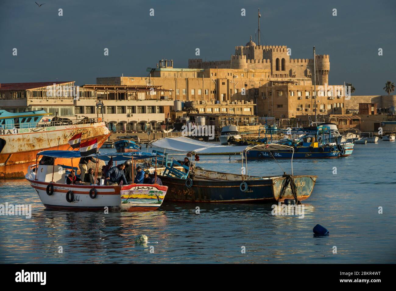 Egypt, Lower Egypt, the Mediterranean coast, Alexandria, the Corniche, fishing boats anchored in the bay, Qait Bay fortress at the back Stock Photo