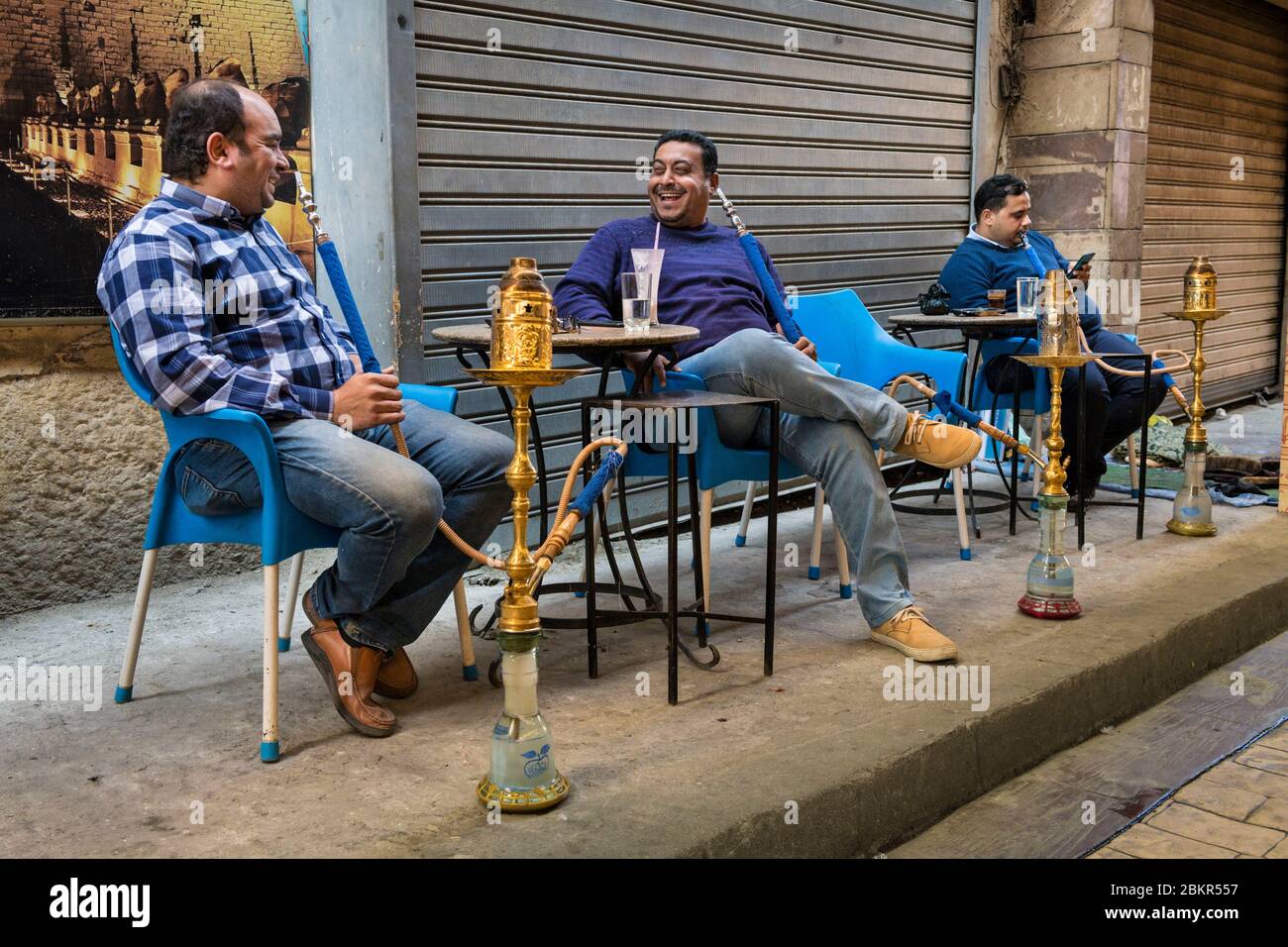 Egypt, Upper Egypt, Nile valley, Luxor, men smoking shisha or narghile pipe Stock Photo