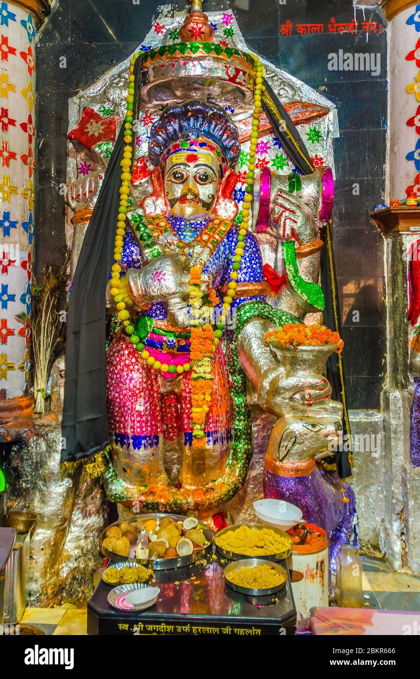 JODHPUR, INDIA – DEC. 02, 2019: Lord Shri Kala Bheruji Hindu God's idol inside Sree Kala Gora Bheruj Nath Temple, Mandore garden, Jodhpur, Rajasthan, Stock Photo