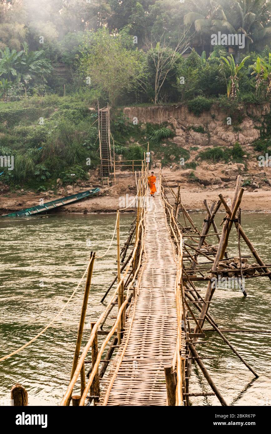 Laos, Luang Prabang city classified UNESCO world heritage, bamboo bridge over Nam Khan river Stock Photo