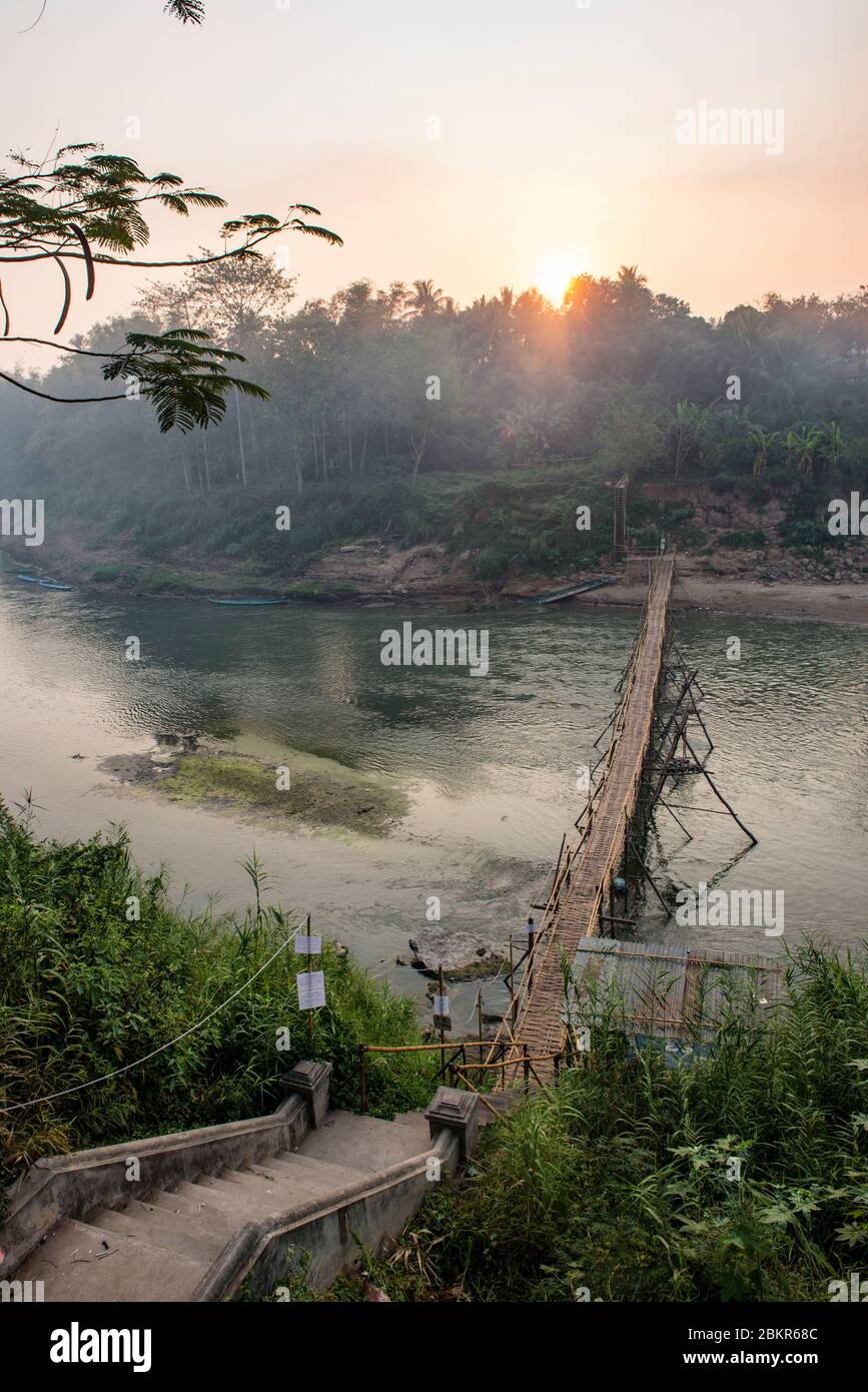 Laos, Luang Prabang city classified UNESCO world heritage, bamboo bridge over Nam Khan river Stock Photo