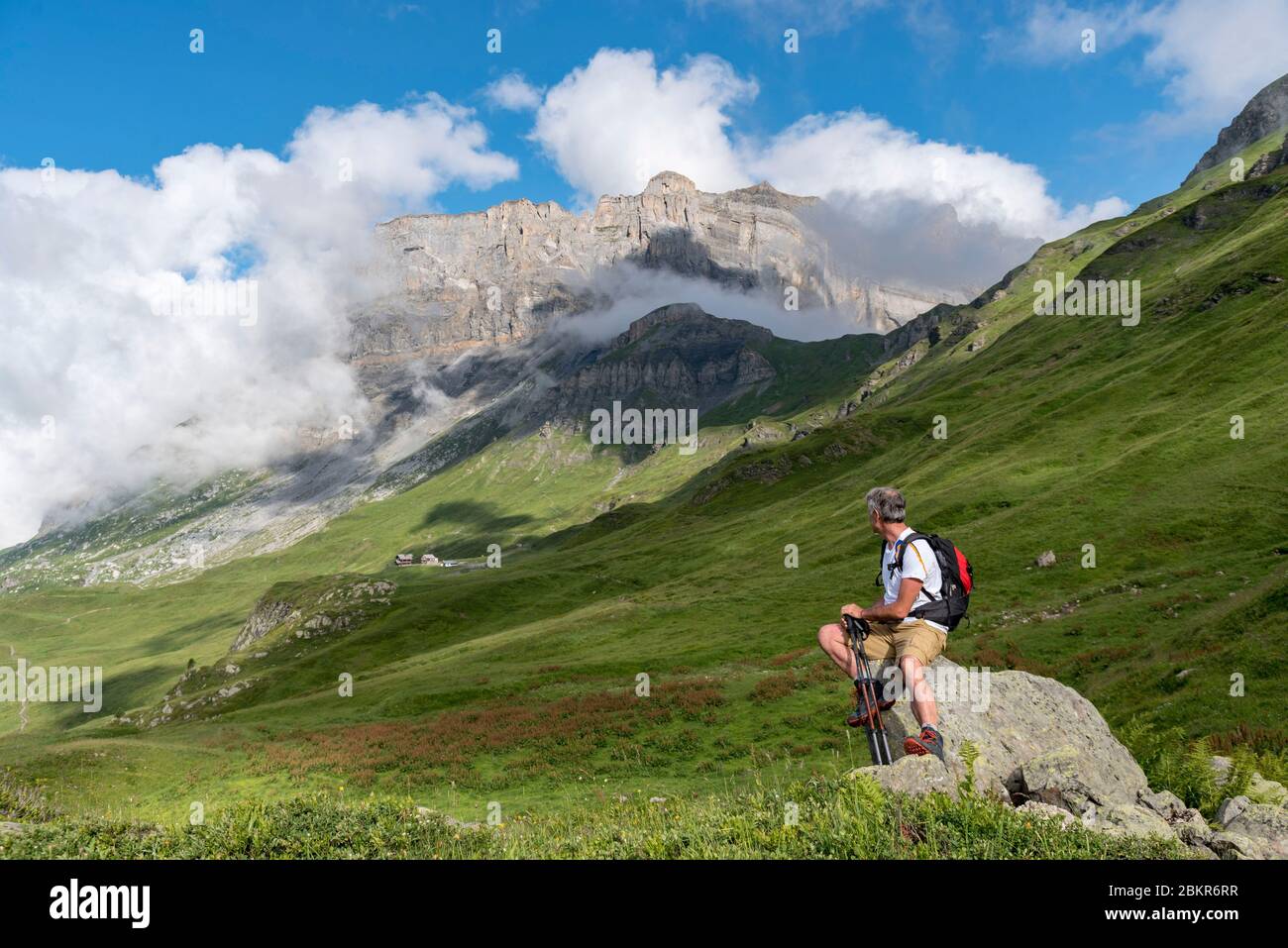 France, Haute-Savoie (74), Passy, Plaine Joux, hiker contemplating the Rochers des Fiz Stock Photo