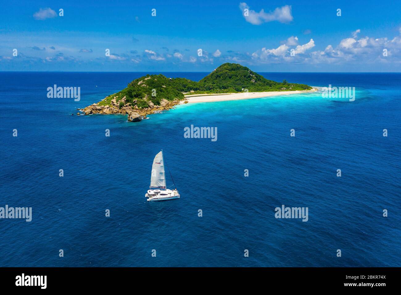 Seychelles, Cousine island, boat under sails (aerial view Stock Photo