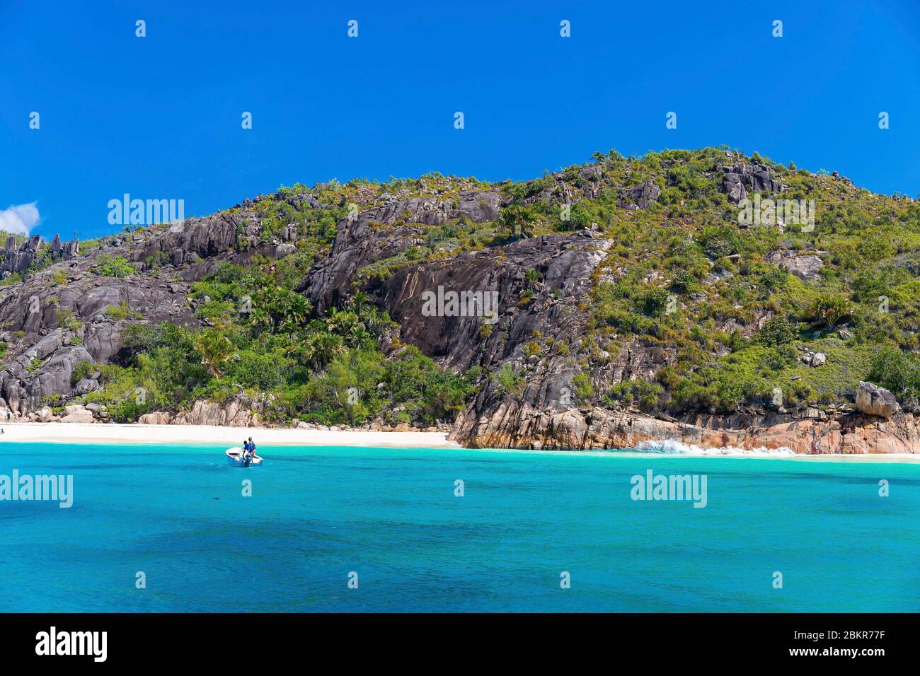Seychelles, Curieuse Island, fishing boat in front of San Jose beach Stock Photo