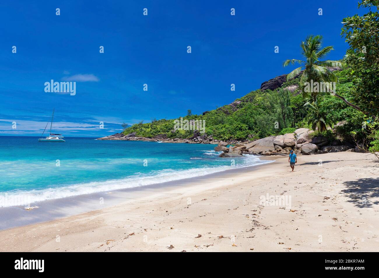 Seychelles, Mah? island, Anse Major, sailing boat Moorings 4800 at the anchor, man on the beach Stock Photo