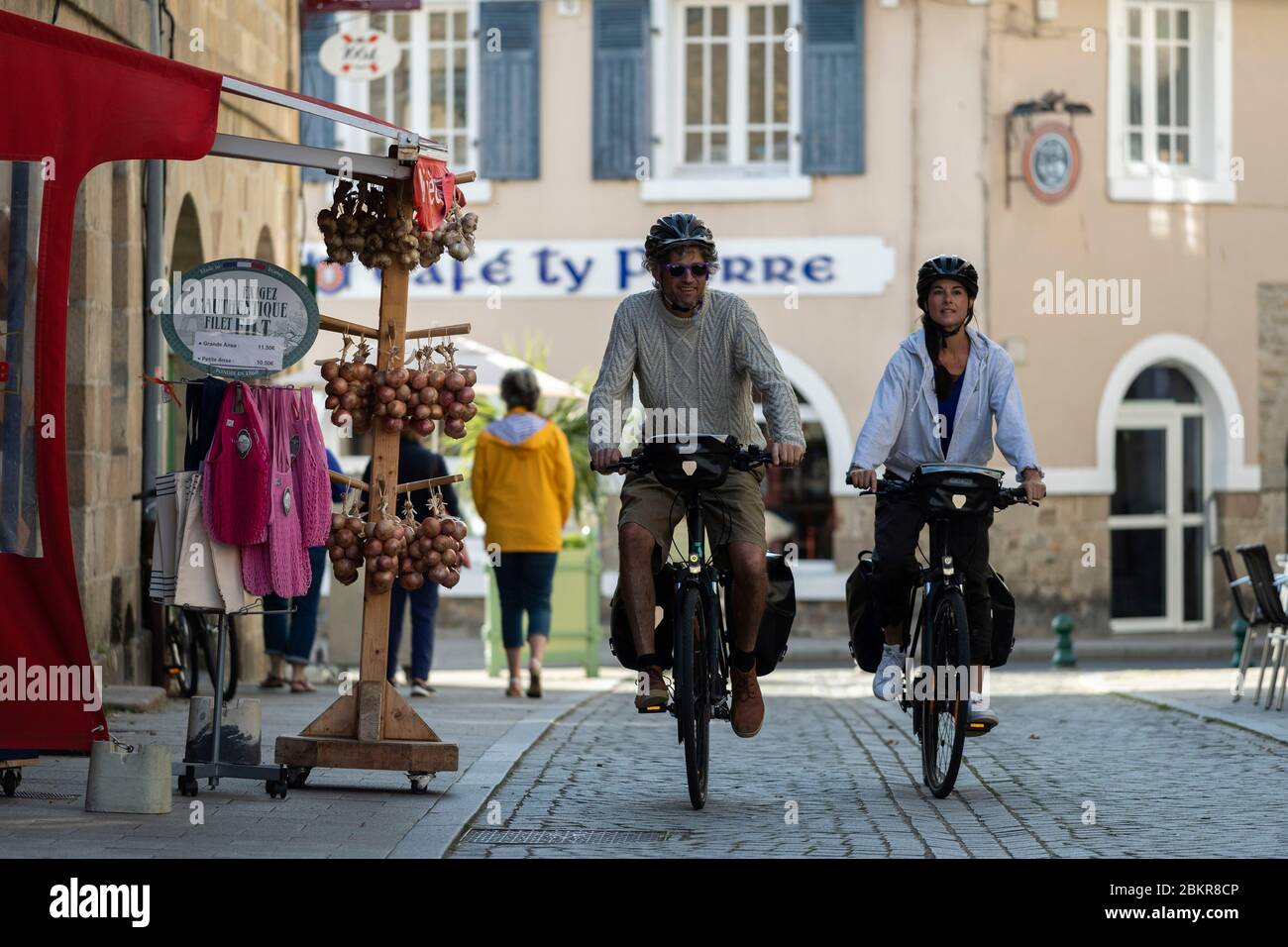 France, Finistere, Roscoff, cycle tourists in the old town, along the