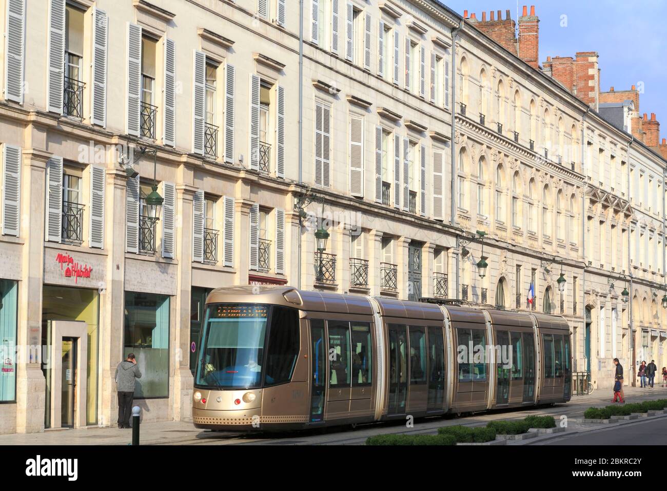 France, Loiret, Orleans, rue Jeanne d'Arc, 19th century building facades with the tram Stock Photo