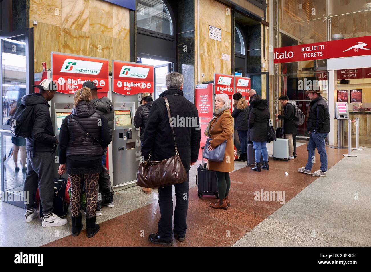 Italy, Emilia Romagna, Bologna, Bologna Centrale railway station, buying tickets at an ATM Stock Photo