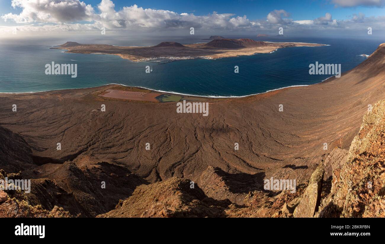 Spain, Canary islands, Lanzarote island, general view of the northern cape of the island with Famara beach lying down and the island of Graciosa Stock Photo