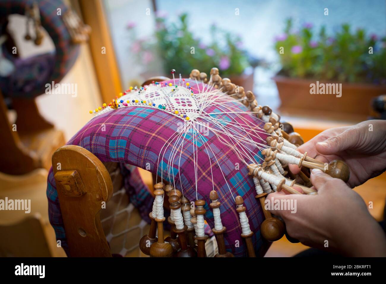 Italy, Aosta Valley, Cogne Valley, traditional crafts very alive: Cogne lace, tiles and shuttles are the tools necessary for the activity Stock Photo