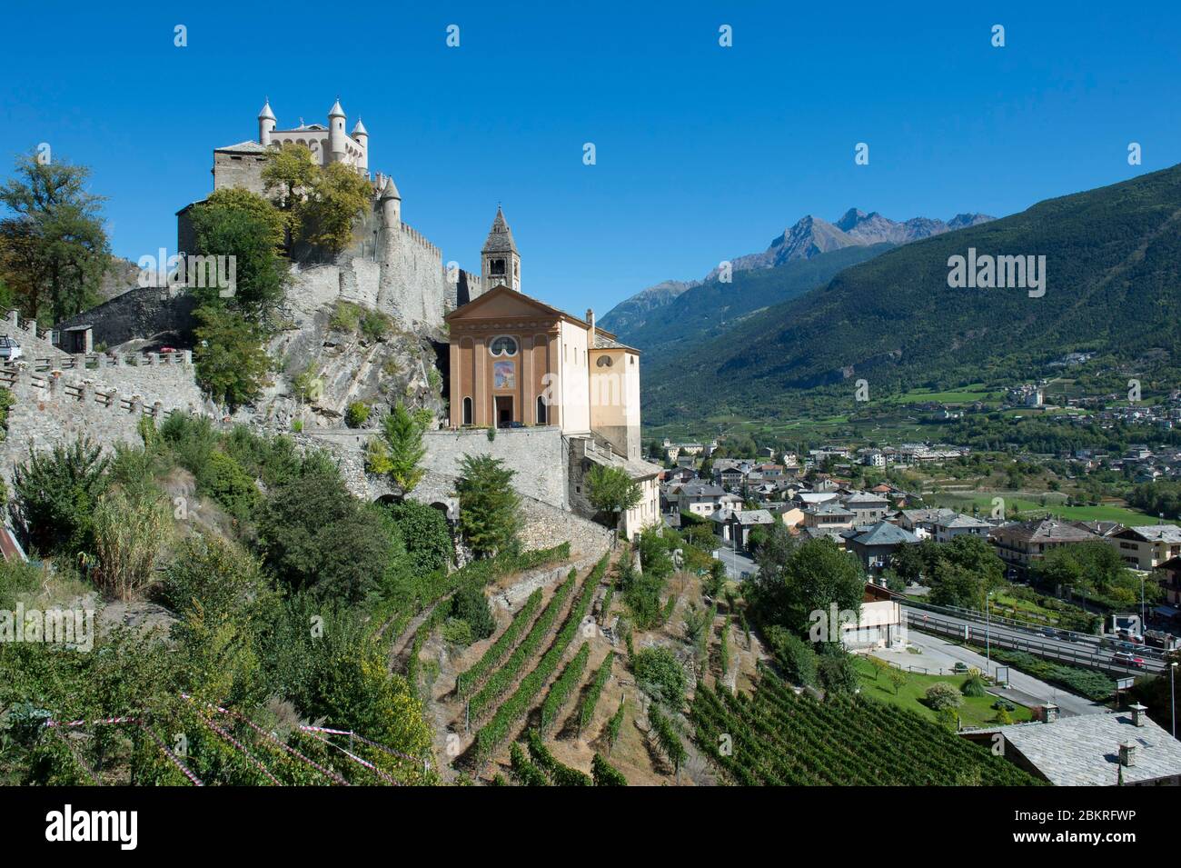 Italy, Aosta Valley, the castle and the Church of Saint Peter surrounded by vineyards dominate the Dora Baltea valley Stock Photo