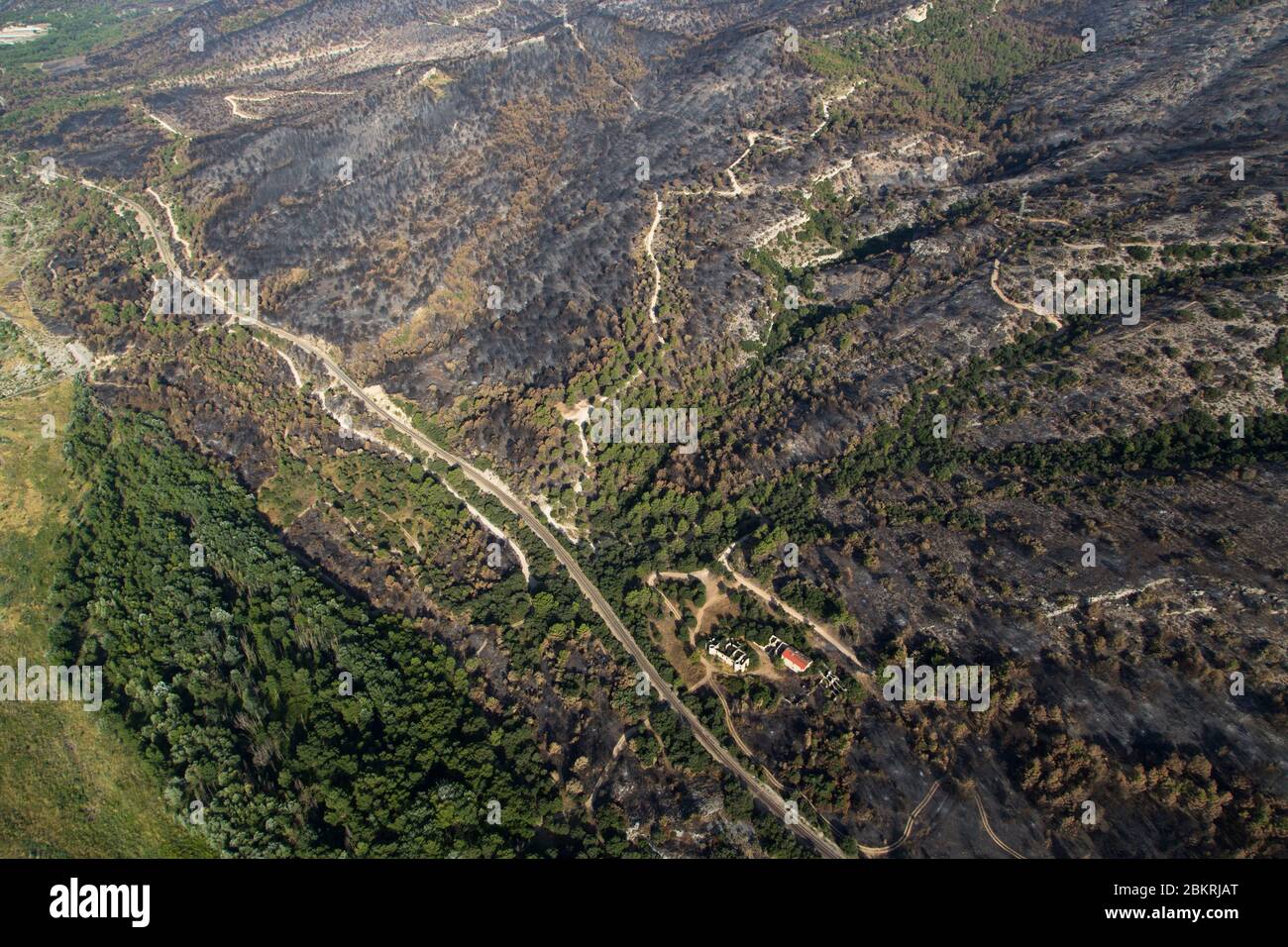 France, Vaucluse, Luberon, the forest fire of July 24, 2017 between Mirabeau and the Bastidonne. the fire ravaged 1300 ha, flyover by motorized paraglider (aerial view) Stock Photo