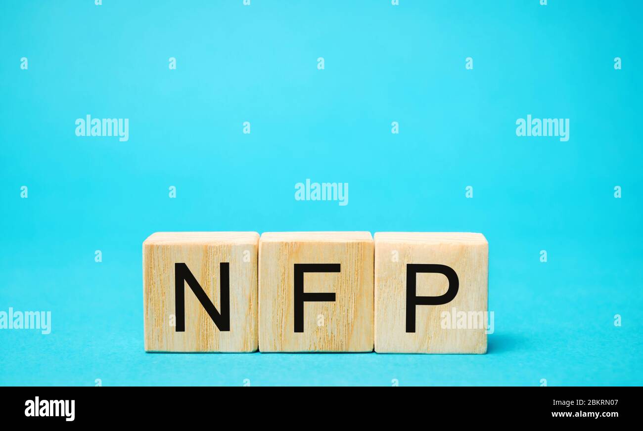 Wooden blocks with the word NFP. Nonfarm Payrolls - key economic indicator. Natural Family Planning concept Stock Photo