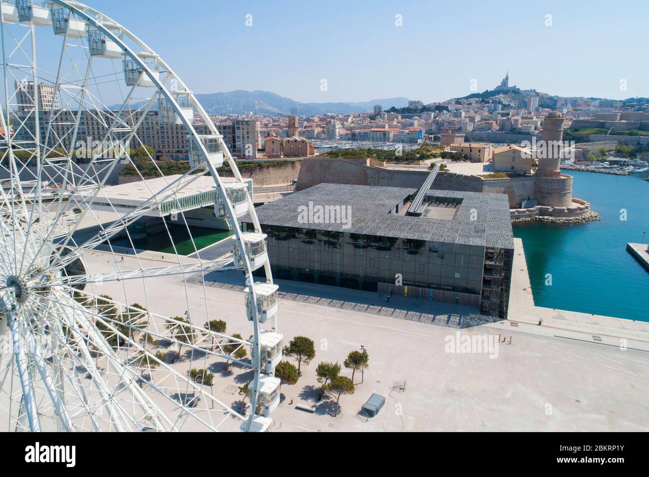France, Bouches du Rhone, Marseille, Covid 19 or Coronavirus lockdown, Esplanade J4, MuCEM or Museum of Civilizations in Europe and the Mediterranean, architect Rudy Ricciotti and Roland Carta and the big wheel (aerial view) Stock Photo