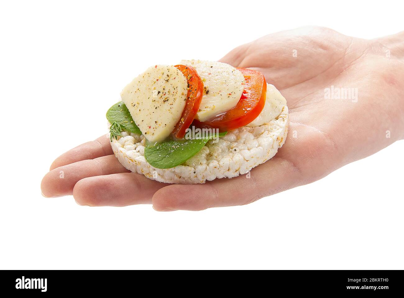 healthy food rice cake sandwich on hand. Rice cookies sandwich isolated