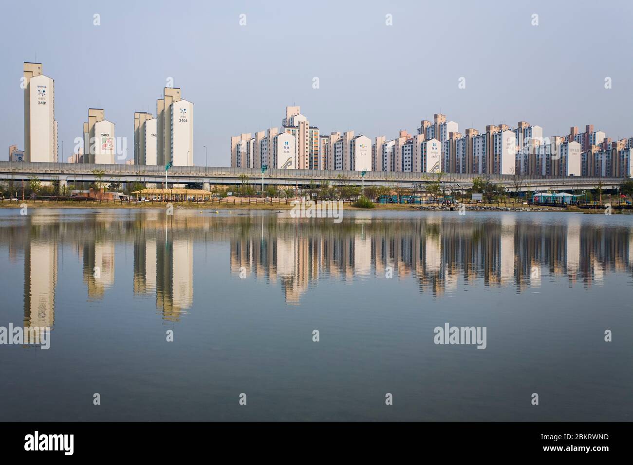 South Korea, Gyeonggi Province, Bucheon, reflection of buildings in a lake Stock Photo
