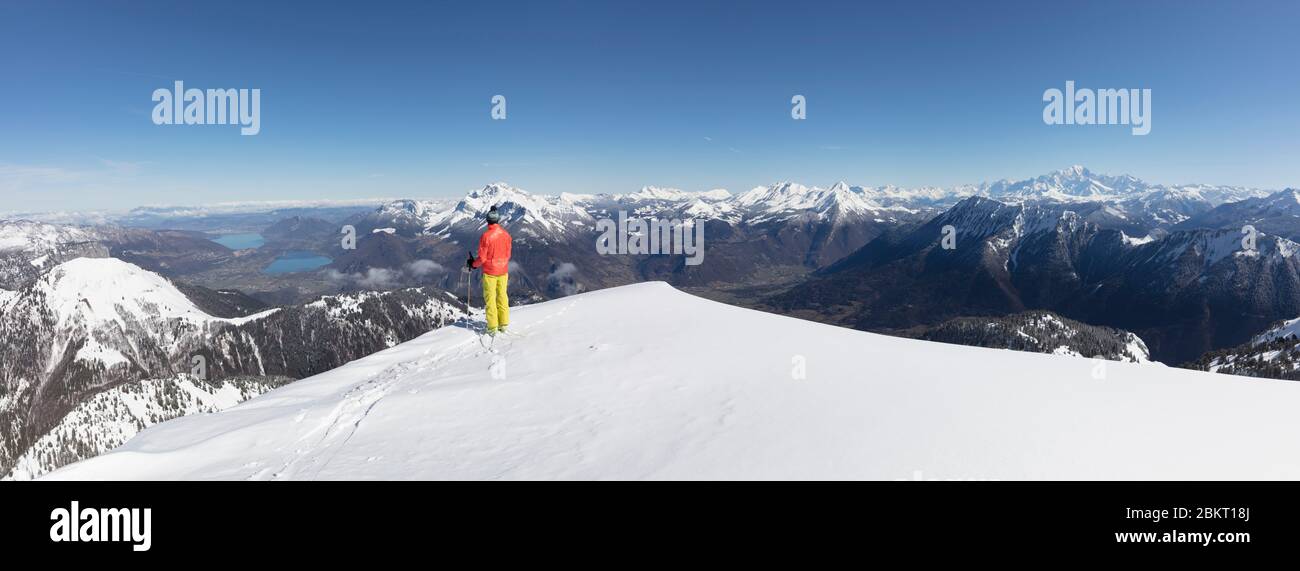France, Haute Savoie, Sambuy massif, ski touring with view of the lakes of Annecy under the snow Stock Photo