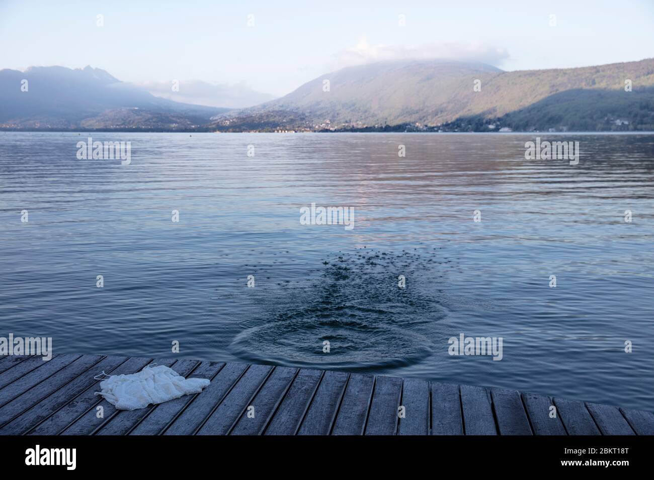 France, Haute Savoie, Annecy, Lake Annecy, dress posed on a pontoon facing the lake Stock Photo