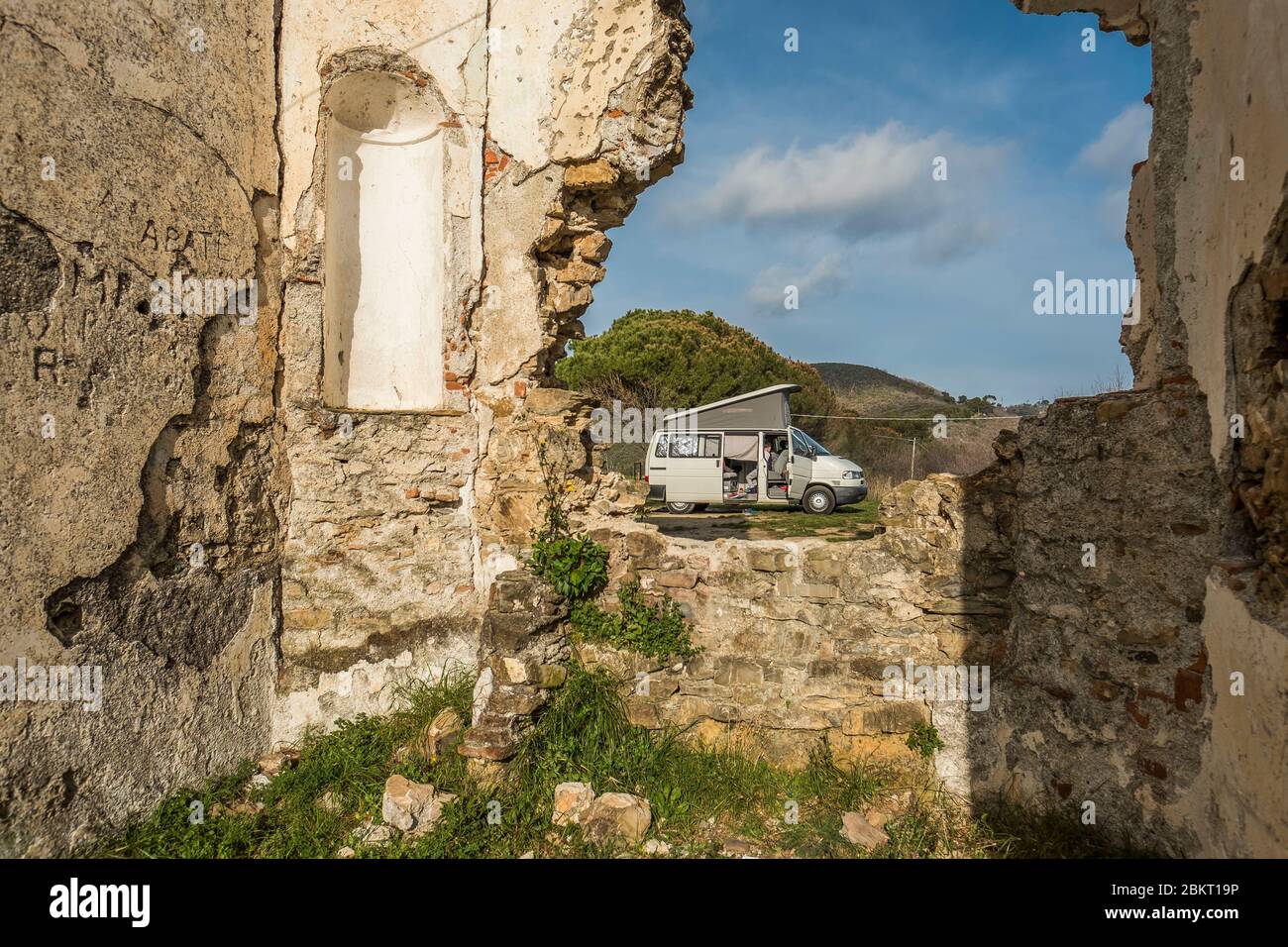 Italy, Province of Cuneo, Cuneo, bivouac at the foot of an abandoned church Stock Photo
