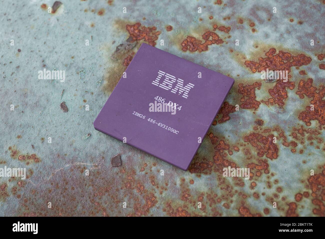 KYIV, UKRAINE - April 22, 2020. IBM 486DX4 processor on rusty background. Stock Photo
