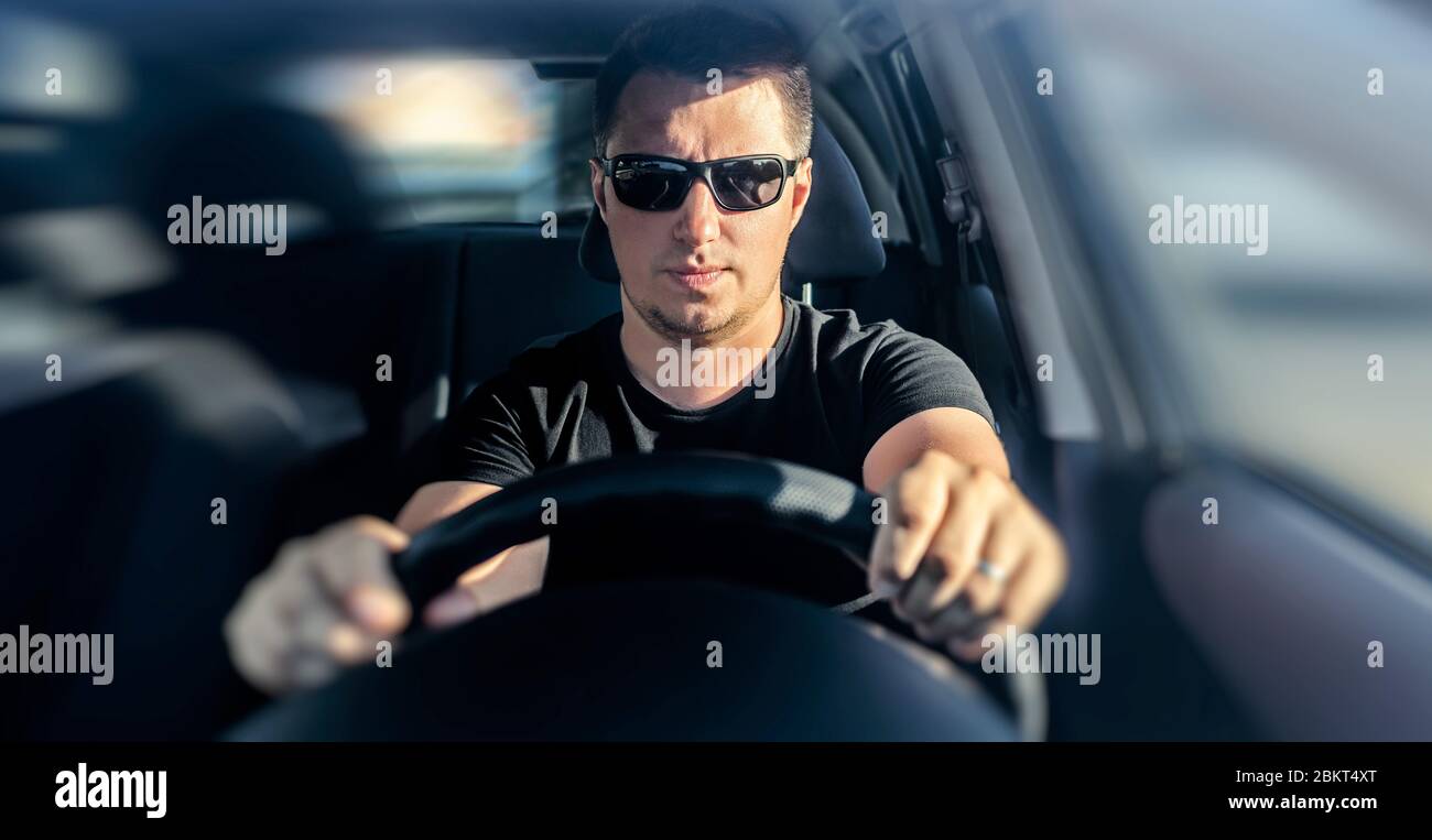 Handsome man driving his car Stock Photo - Alamy