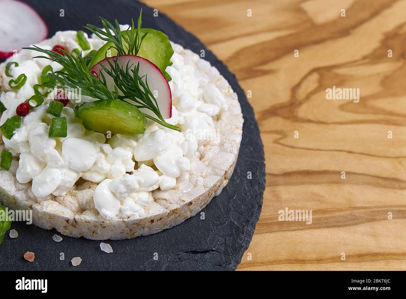 healthy food rice cake salted sandwich on wood table. Rice cakes as light breakfast concept