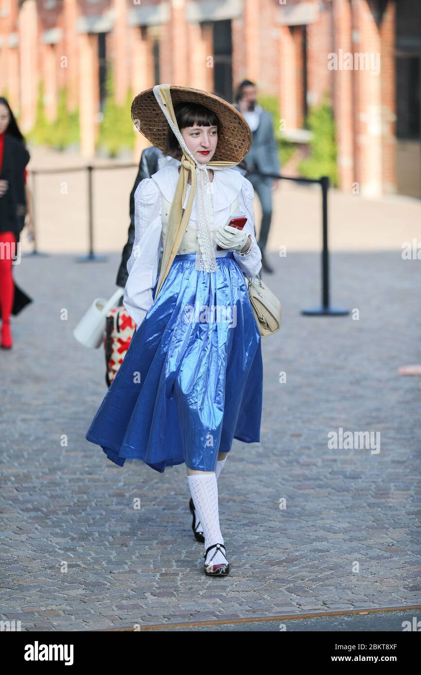 February 19, 2020: model wears a shiny blue skirt, white stockings and  black flat shoes during the Gucci fashion show at the women`s fashion week  fall Stock Photo - Alamy