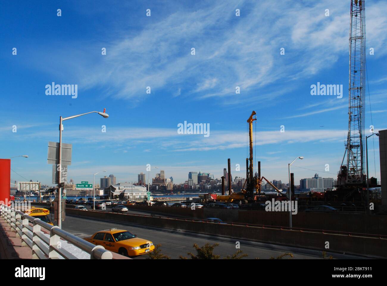 Yellow Taxi Highway Brooklyn Skyline Cranes East River FDR Drive, New York, United States Stock Photo