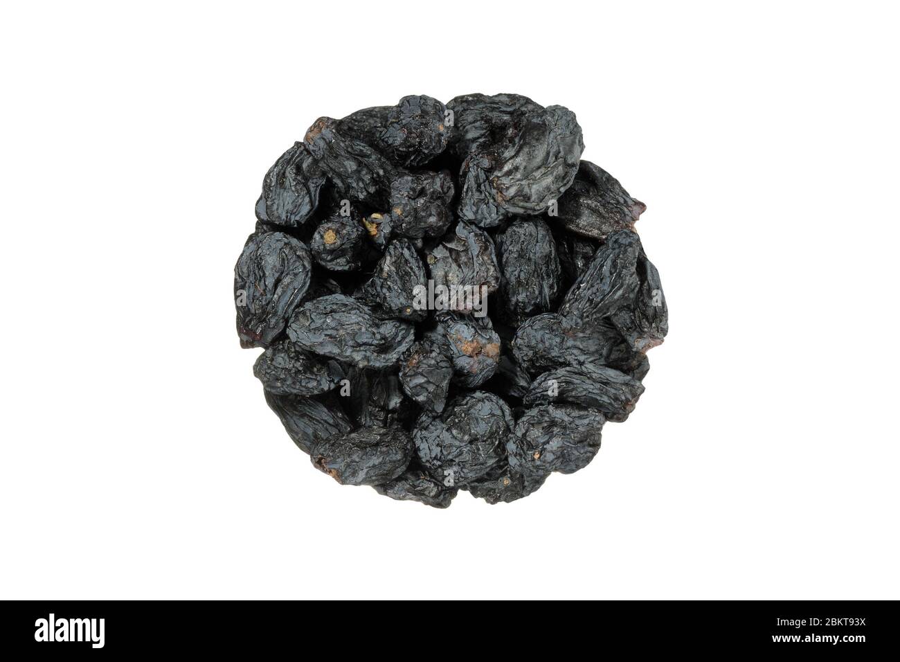 Black dry raisins isolated on white background. Top view. Stock Photo