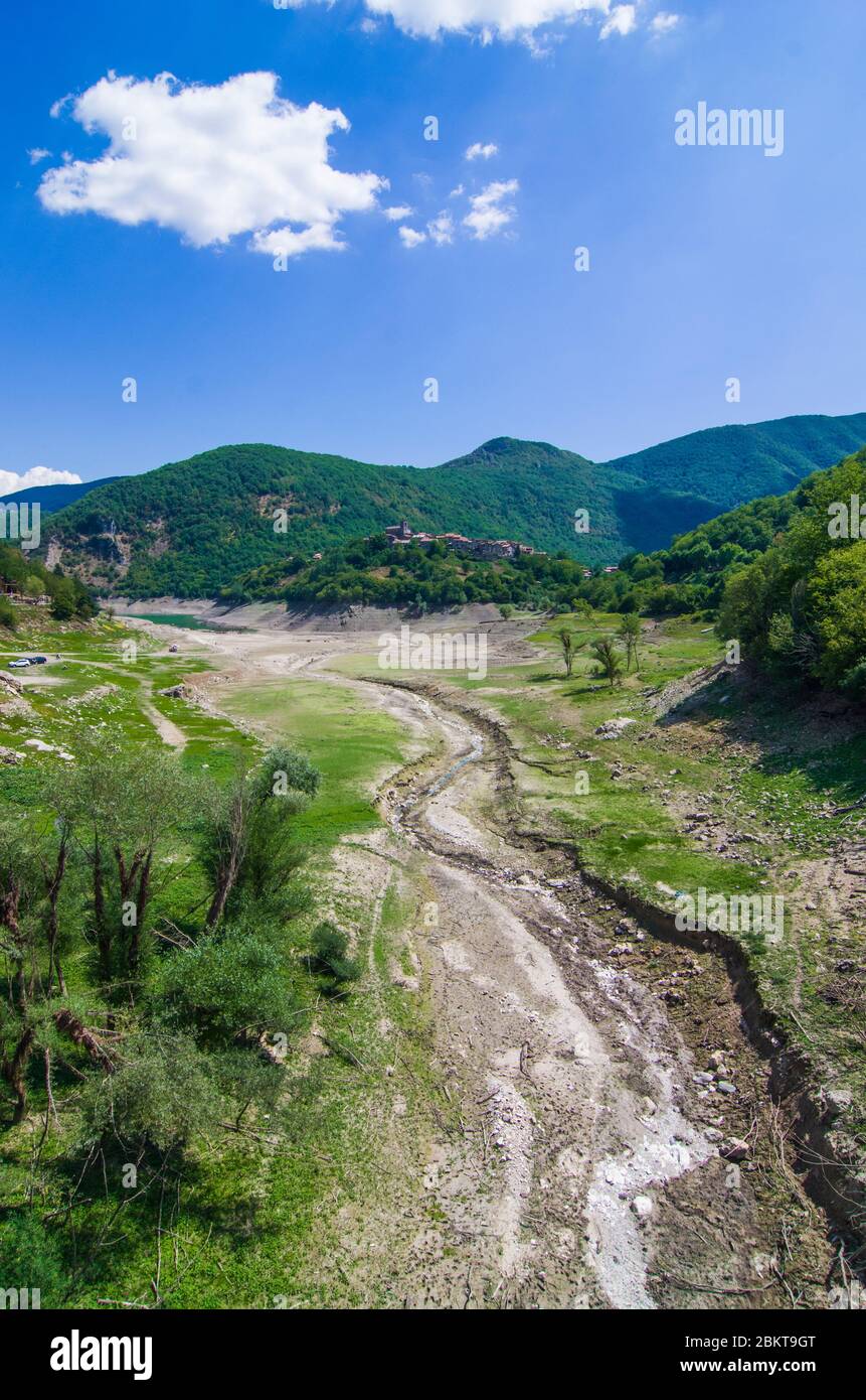 environmental catastrophe, drought drama and rising temperature of the planet earth, dry river, dry vegetation and population of the mountain town wit Stock Photo