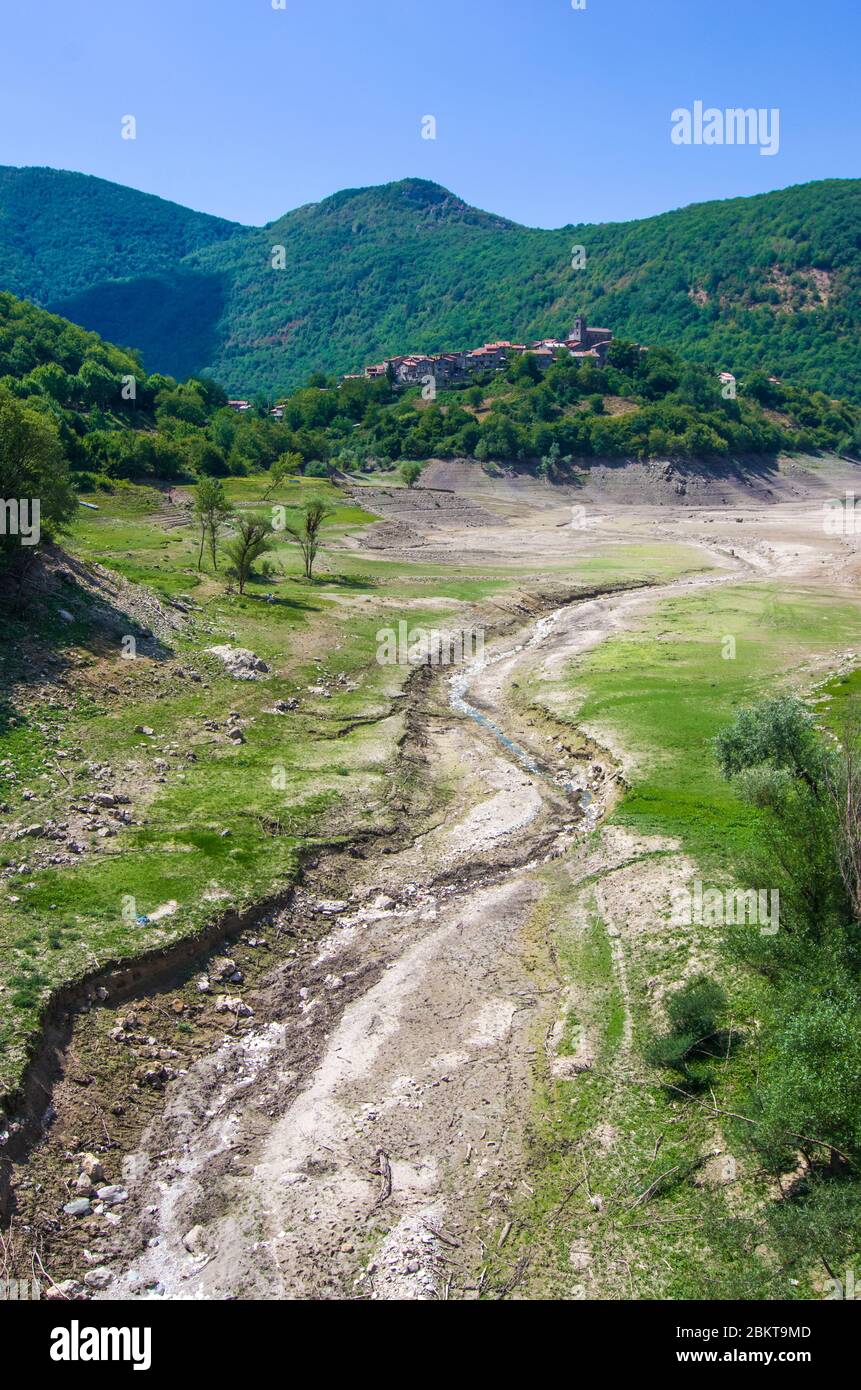 environmental catastrophe, drought drama and rising temperature of the planet earth, dry river, dry vegetation and population of the mountain town wit Stock Photo