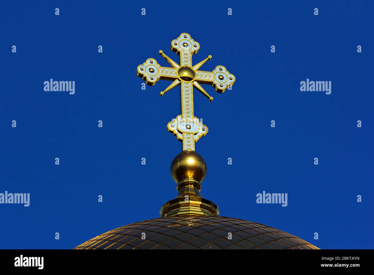 A golden cross on the dome of an Orthodox Christian church Stock Photo ...