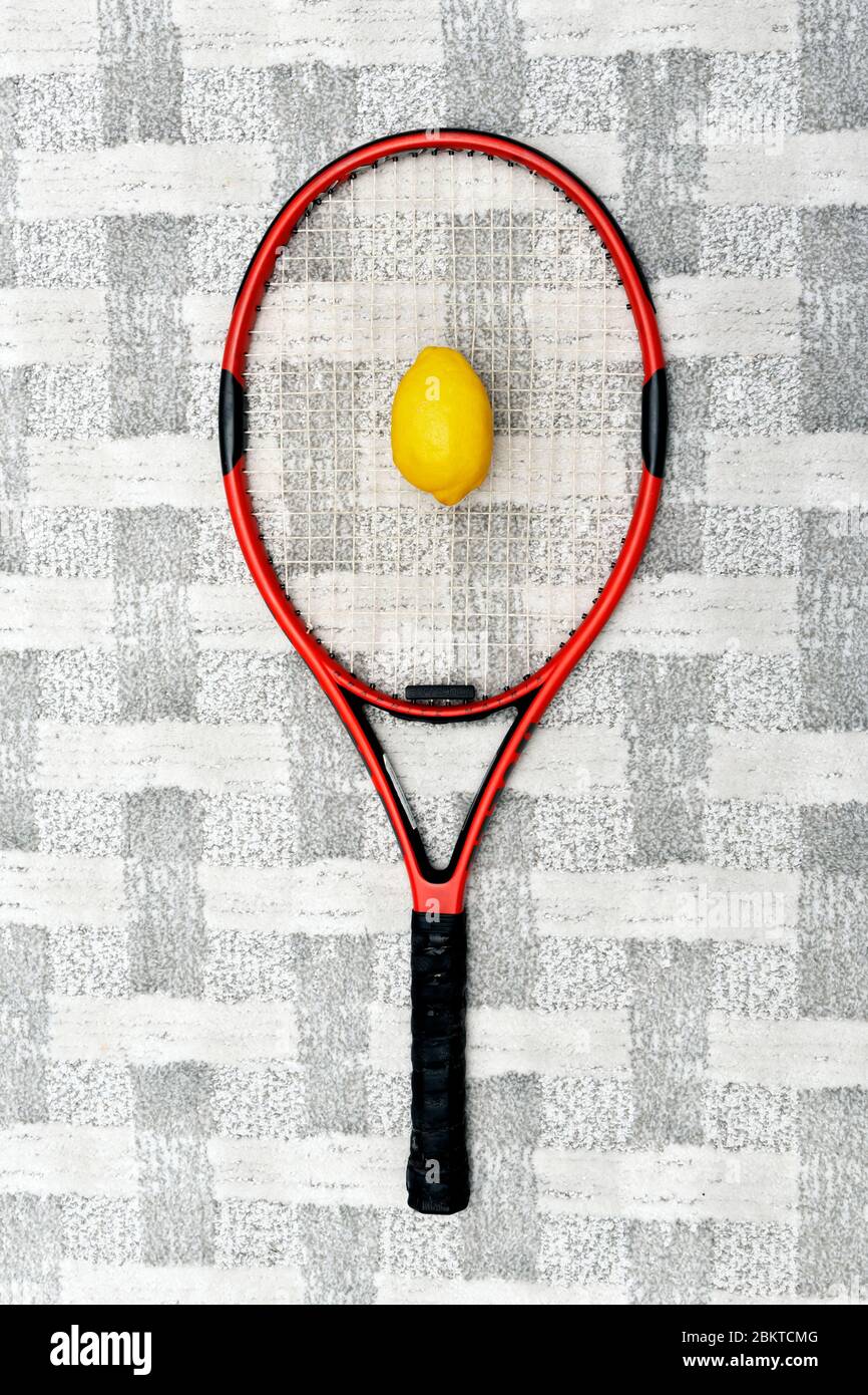 Tennis racket with lemon Stock Photo - Alamy
