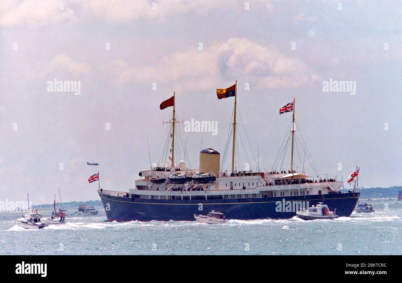 HMY Britannia - Her majesty's Yacht Britannia - Royal Yacht Britannia - leaves Portsmouth Harbour to commence the review of the fleet 50th D Day anniversary 6th June 1994 Stock Photo