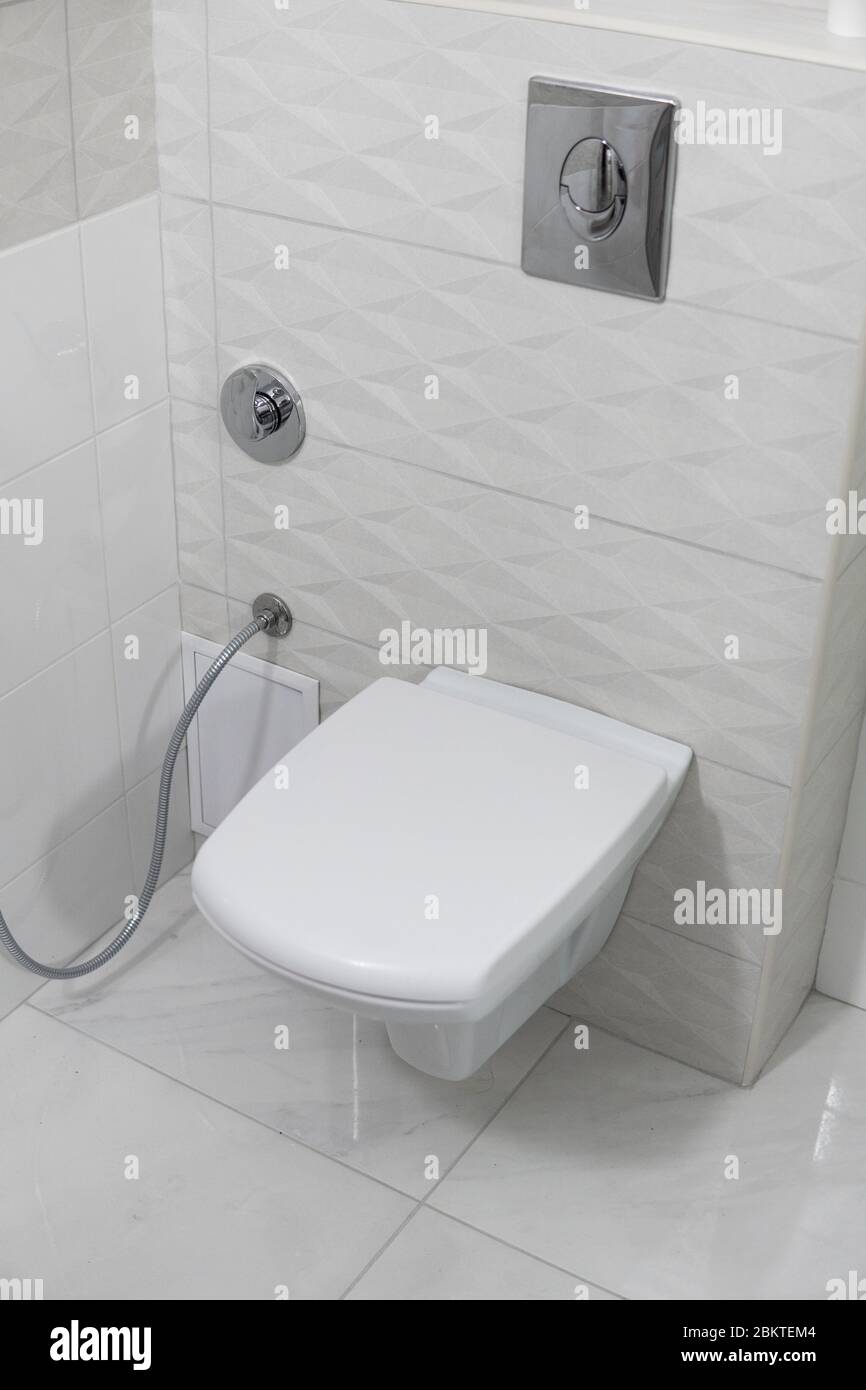 White toilet bowl in modern light bathroom interior Stock Photo - Alamy