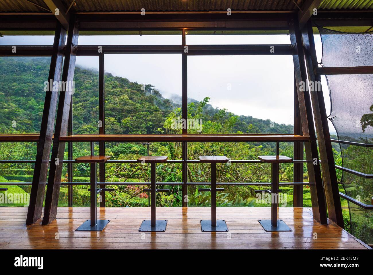 Interior of Celeste Mountain Lodge with views over rainforest in Costa Rica Stock Photo