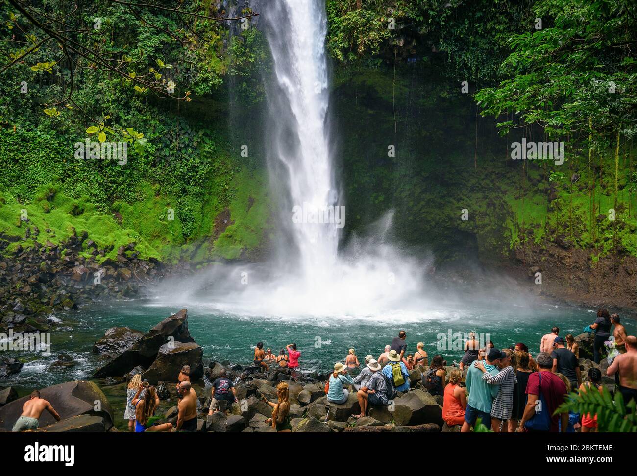 Tourists and locals visiting the La Fortuna waterfall in Costa Rica Stock Photo