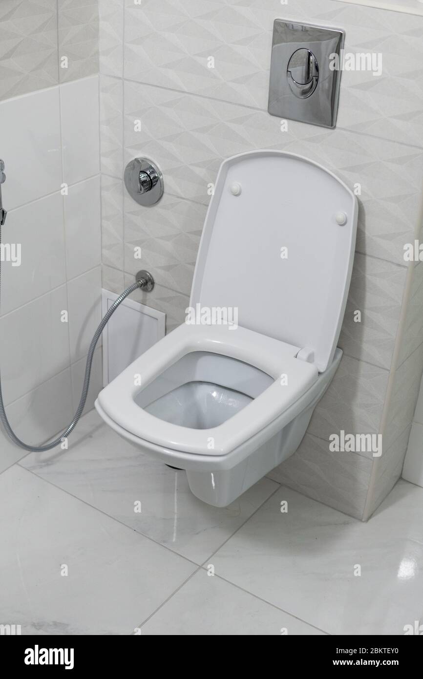 White toilet bowl in modern light bathroom interior Stock Photo - Alamy