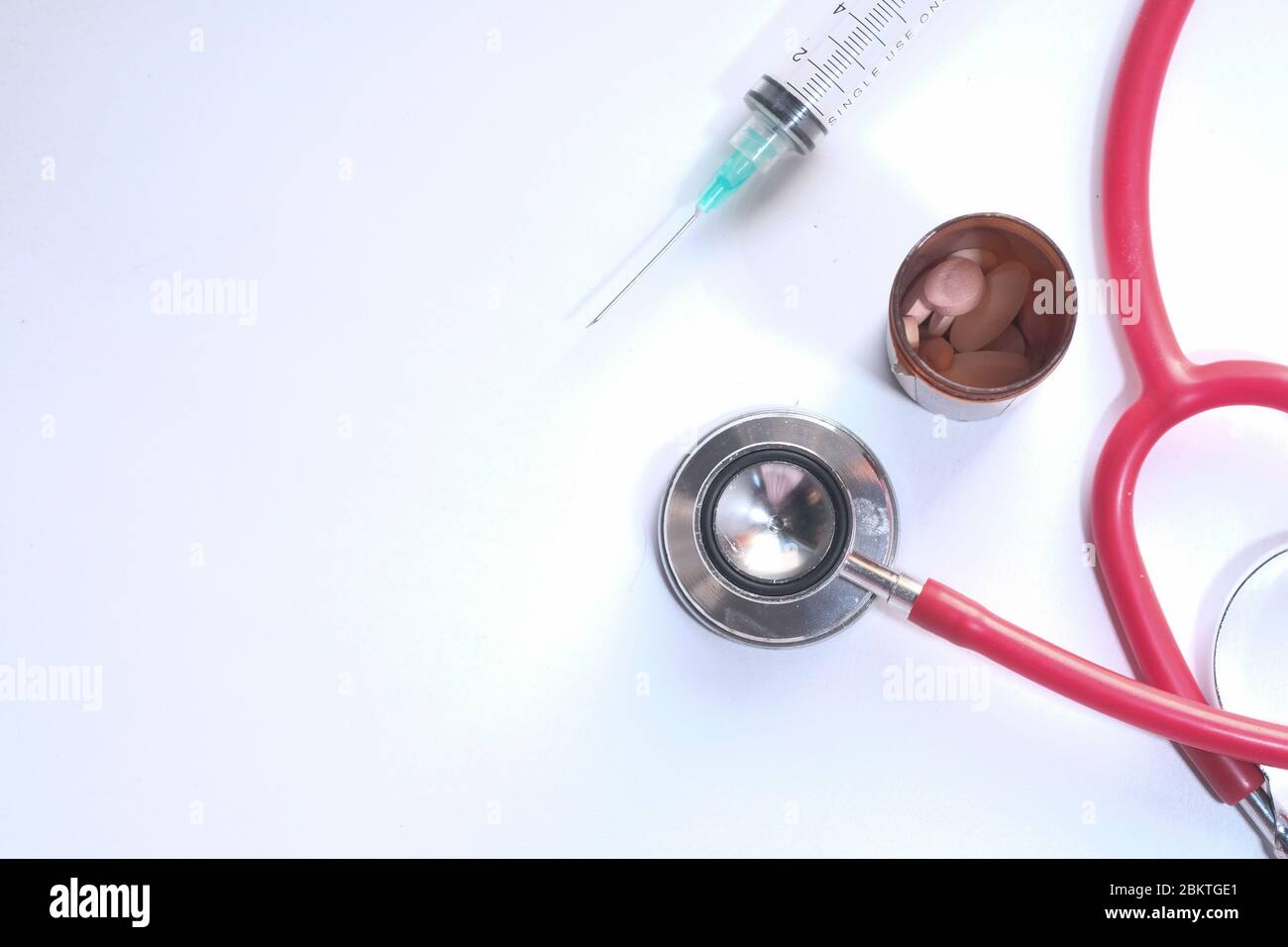 stethoscope, pills, syringe on white background Stock Photo - Alamy