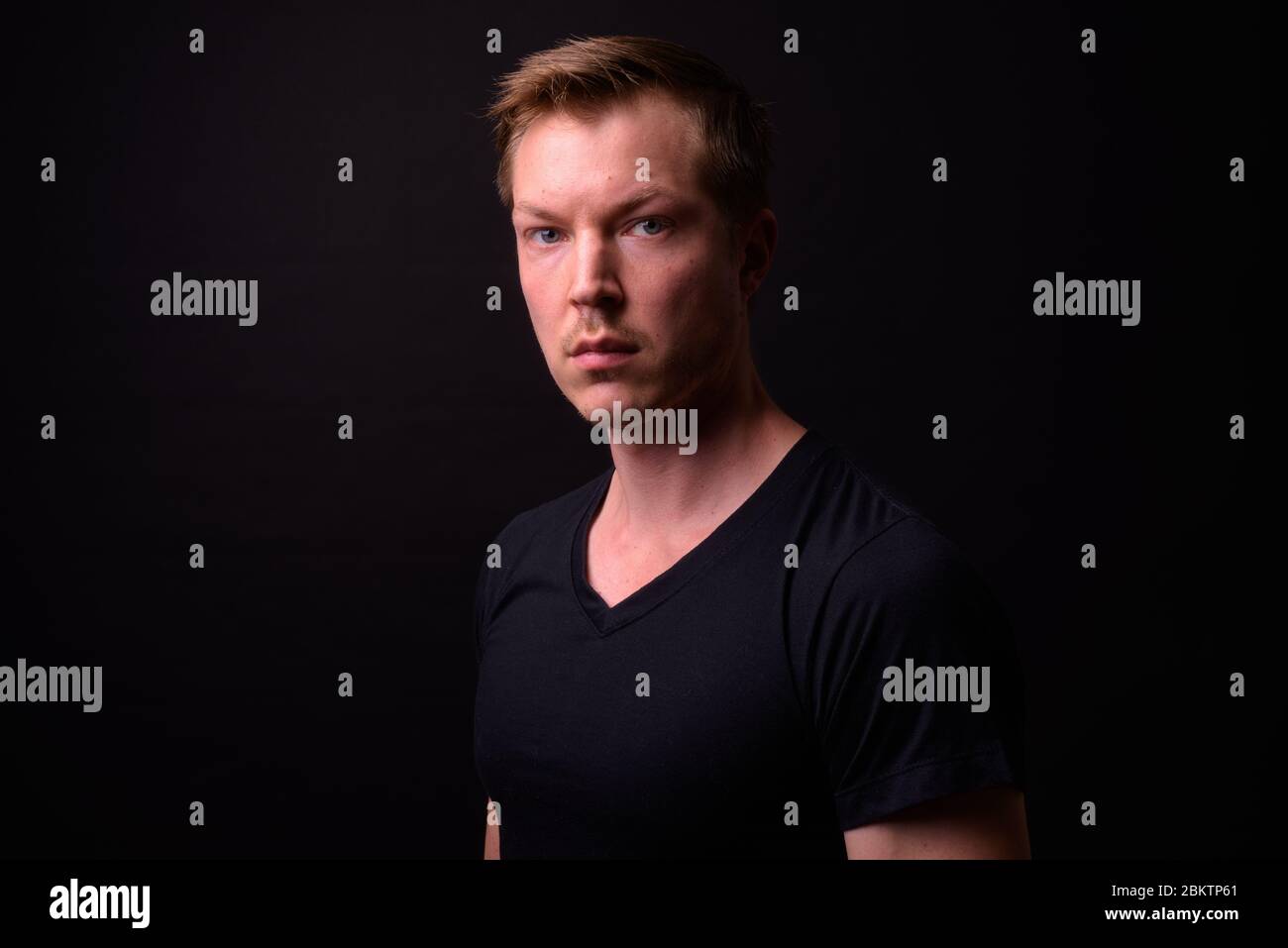 Portrait of young handsome man looking at camera Stock Photo - Alamy