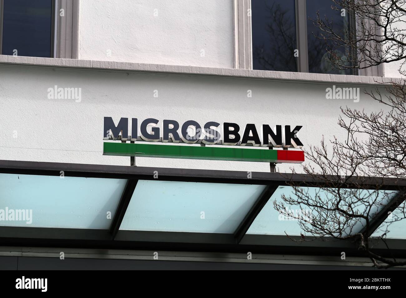 Migros Bank sign in downtown Zürich, Switzerland, March 2020. Migros Bank is a Swiss cooperative bank providing wide range of banking services. Stock Photo