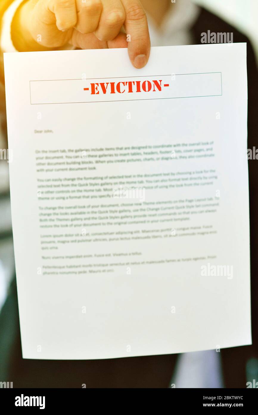 Someone serving an Eviction Notice with hands in view Late Rent Late Mortgage Payment