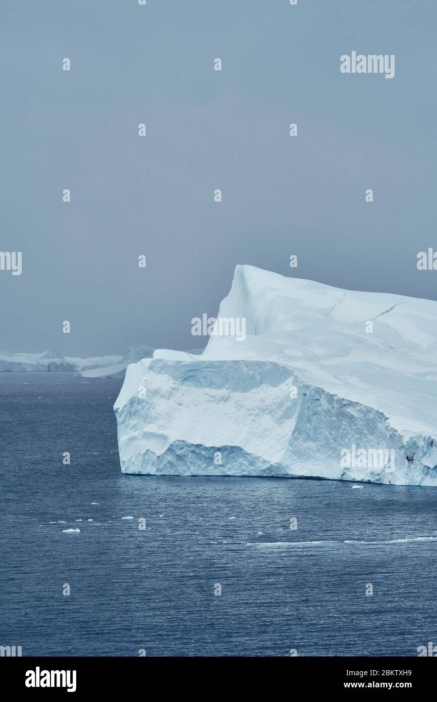 Iceberg at Disco bay Ilulissat in greenland with a gray sky Stock Photo