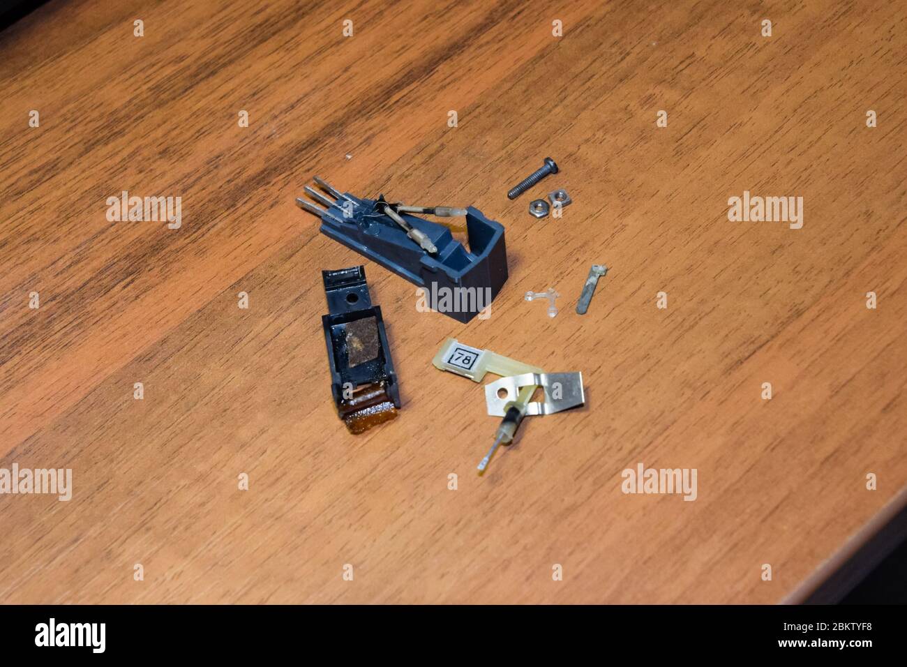 Disassembled vinyl player pickup with a rotary needle. Stock Photo