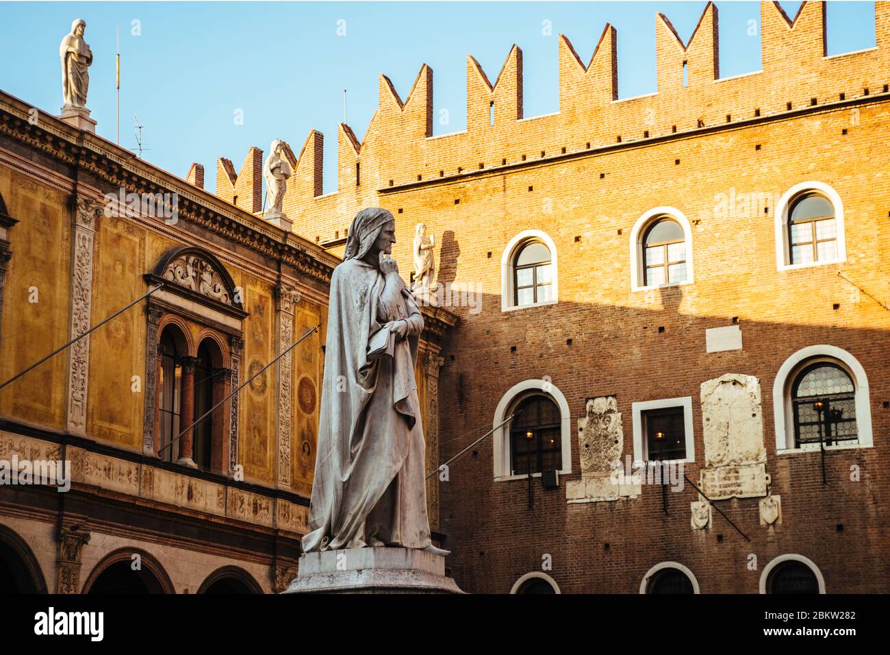 Sculpture of Dante Alighieri in a famous square of Verona Piazza dei Signori Stock Photo